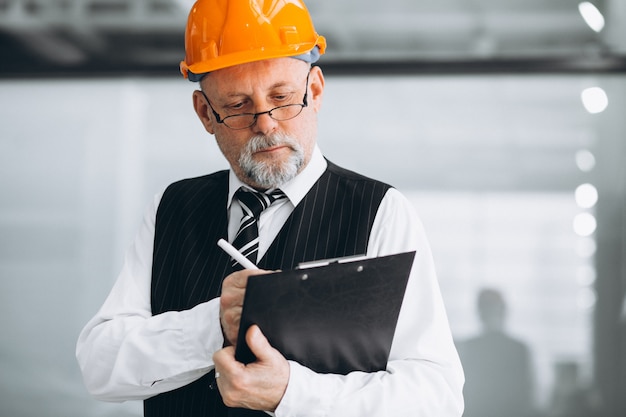 Senior businessman architect in a hard hat