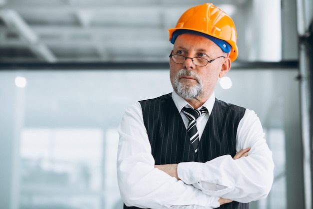 Senior businessman architect in a hard hat