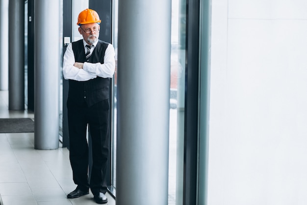 Senior businessman architect in a hard hat