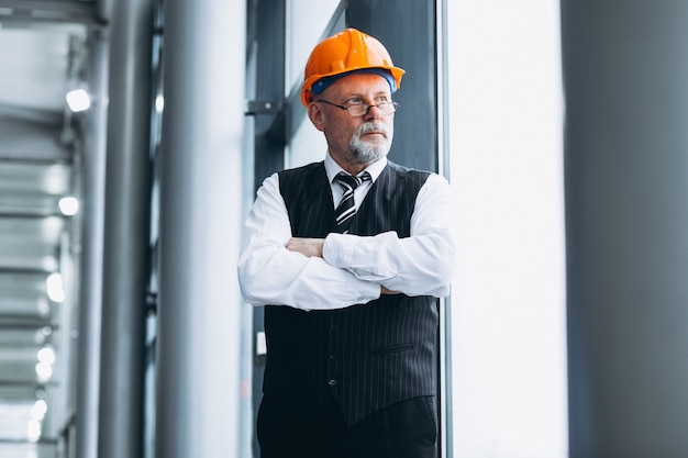 Senior businessman architect in a hard hat