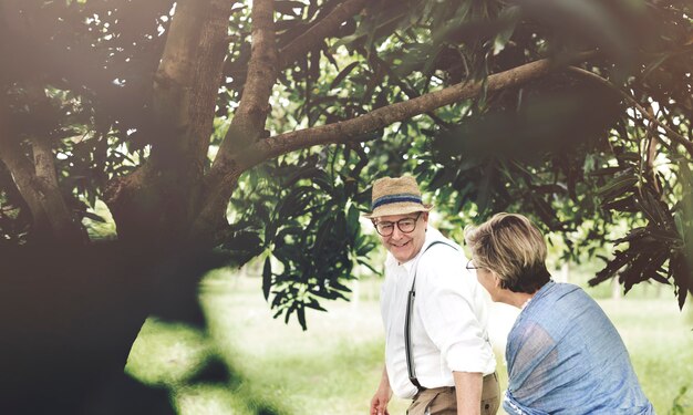 Senior caucasian couple dating in the park together