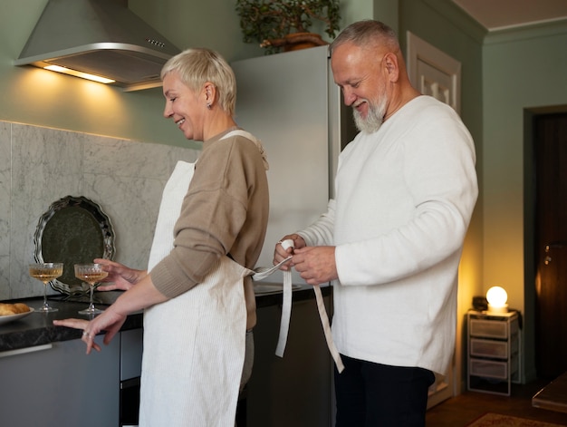 Senior couple dancing at home