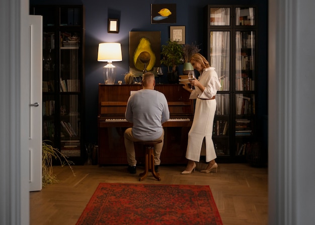 Senior couple dancing at home