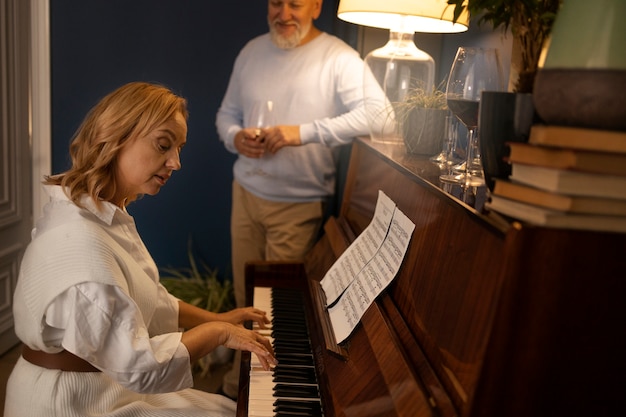 Senior couple dancing at home