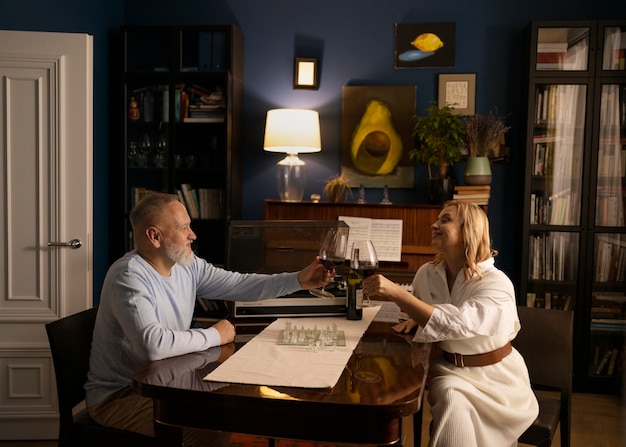 Senior couple dancing at home