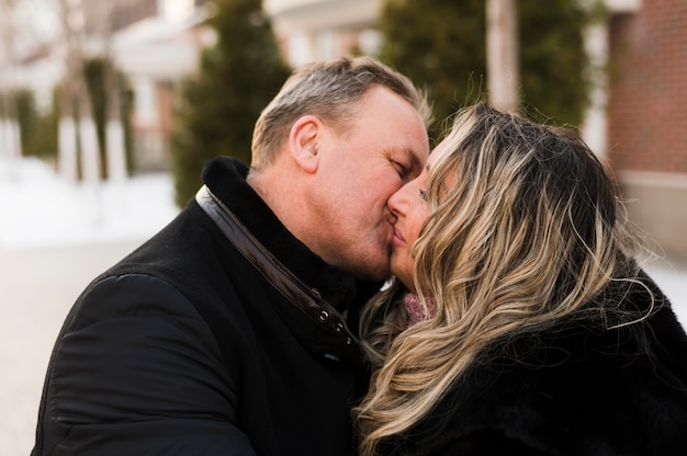 Free photo senior couple kissing close up