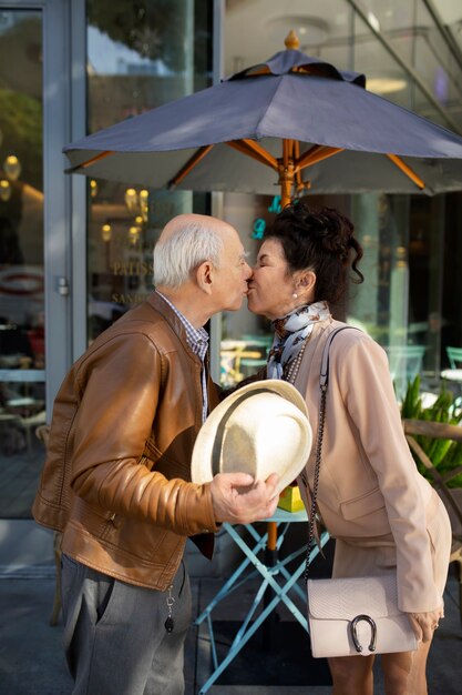 Senior couple kissing while being on a date