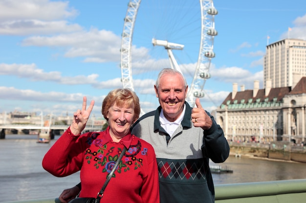 Senior couple in london with millenium wheel