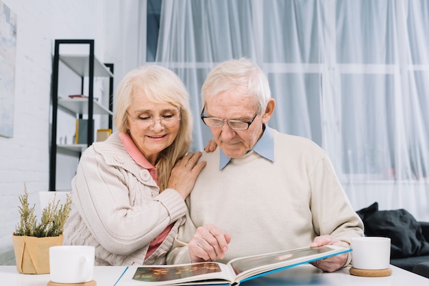 Senior couple looking at photo album