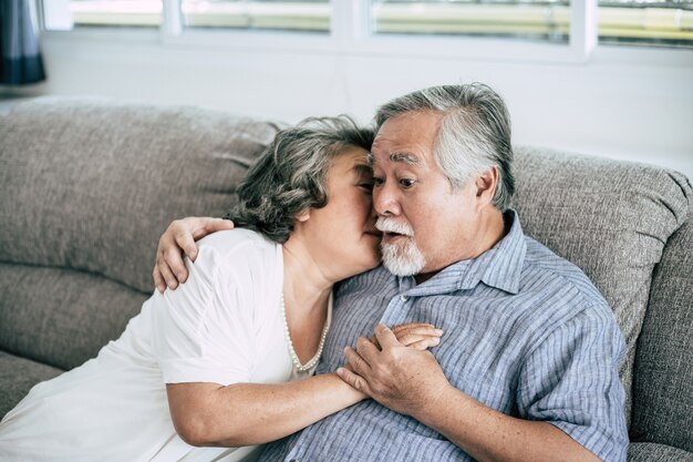 Senior couple Playing together at living room