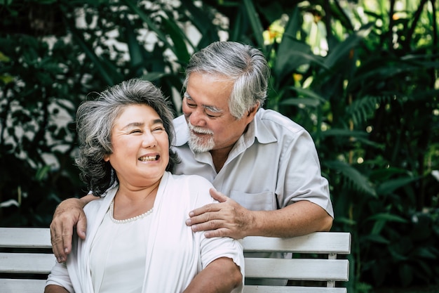 Free photo senior couple playing together at park