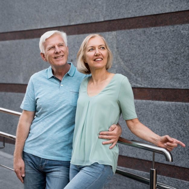 Senior couple posing together outdoors