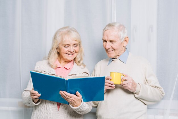 Senior couple reading book