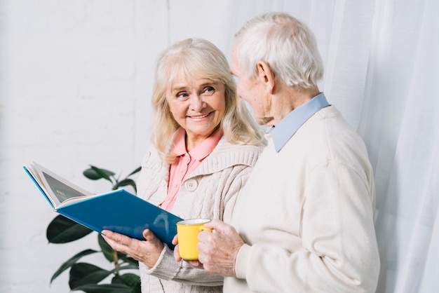 Senior couple reading book