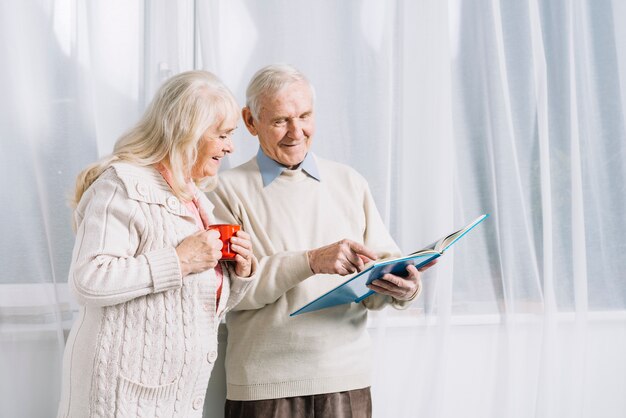 Senior couple reading book