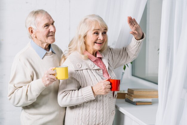 Senior couple saying hello