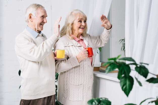 Senior couple saying hello