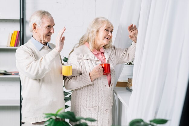 Senior couple saying hello