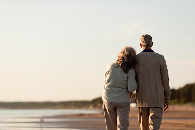 Senior couple at seaside medium shot