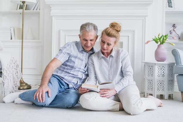 Senior couple together on the floor