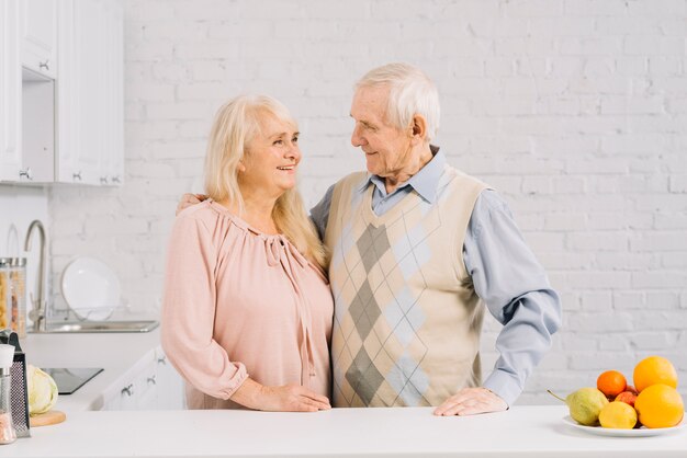 Senior couple together in kitchen