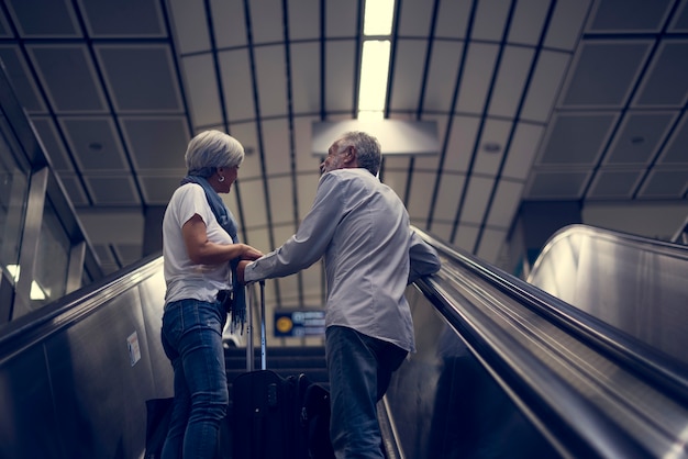 Senior couple traveling around the city