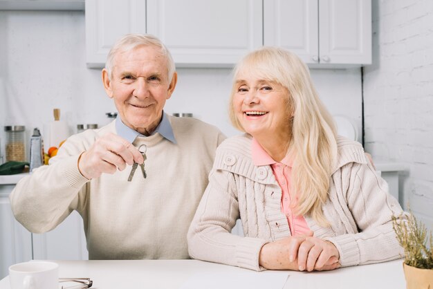 Senior couple with keys