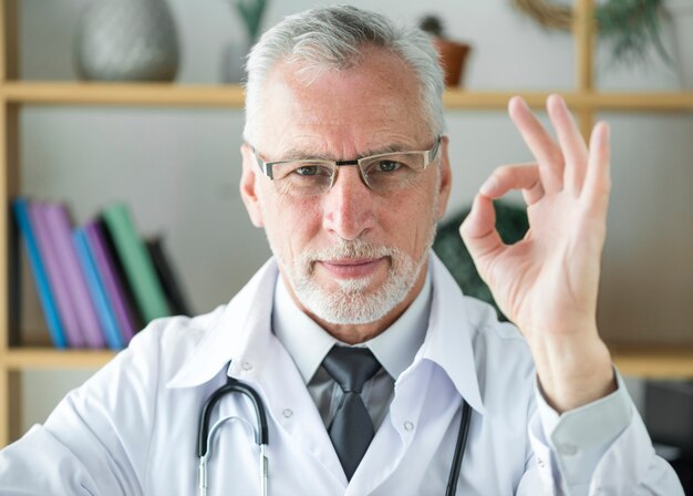 Senior doctor gesturing OK