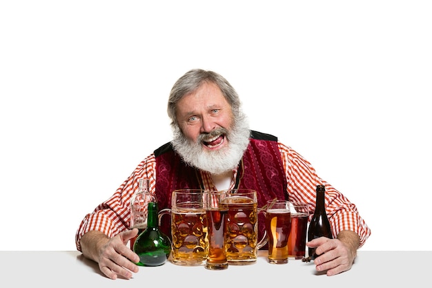 senior expert male barman with beer at isolated on white background.