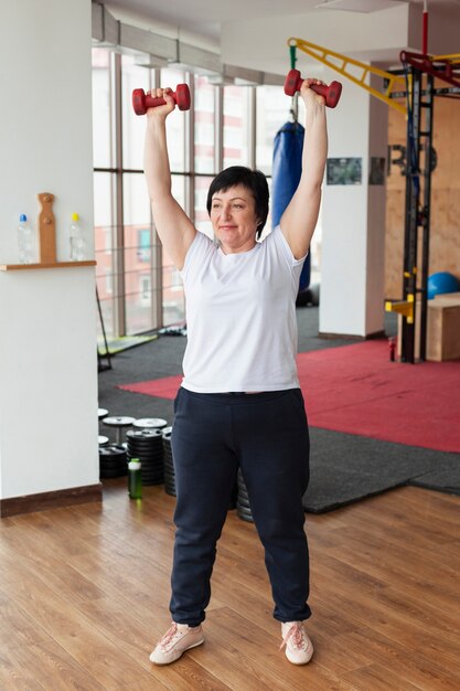 Senior female with weights