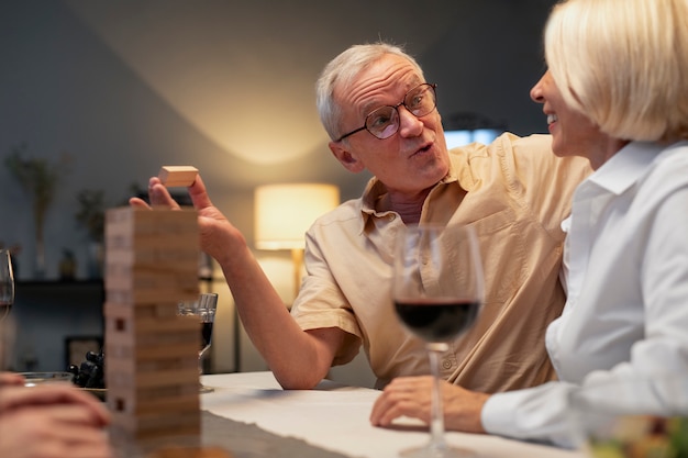 Senior friends having a party at night