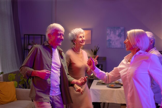 Senior friends having a party at night