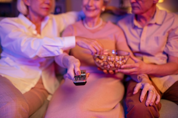 Free photo senior friends having a party at night