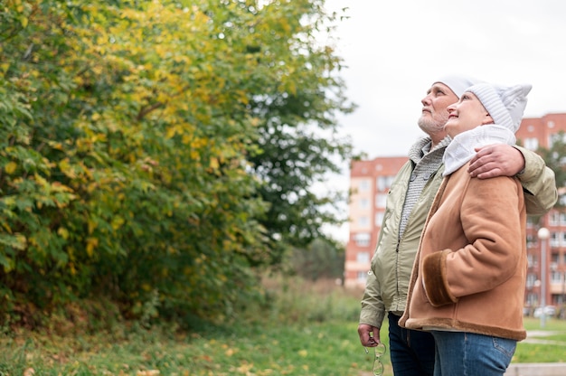 Free photo senior lovely couple hugging outdoor