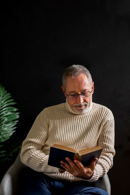 Senior male enjoying reading