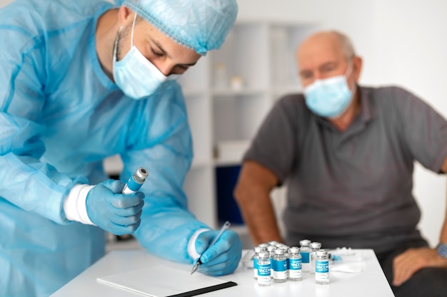 Senior male patient getting vaccinated for coronavirus