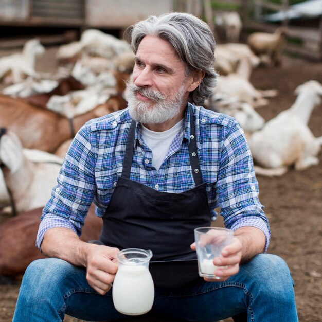 Senior man drinking goat milk