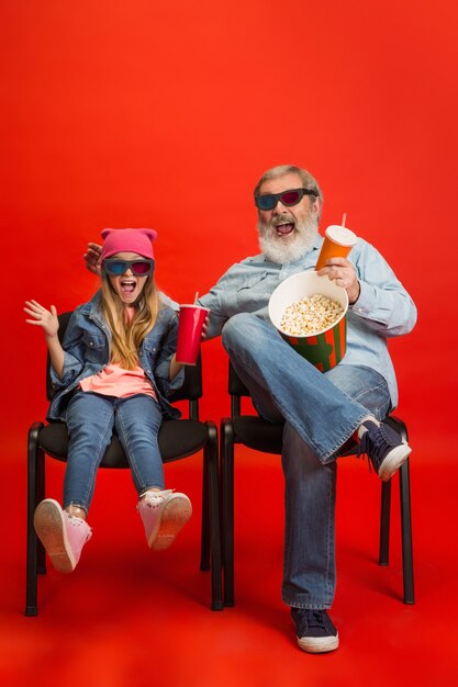 Senior man, grandfather having fun and spending time together with girl, granddaughter.