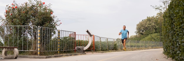 Senior man jogging through the park