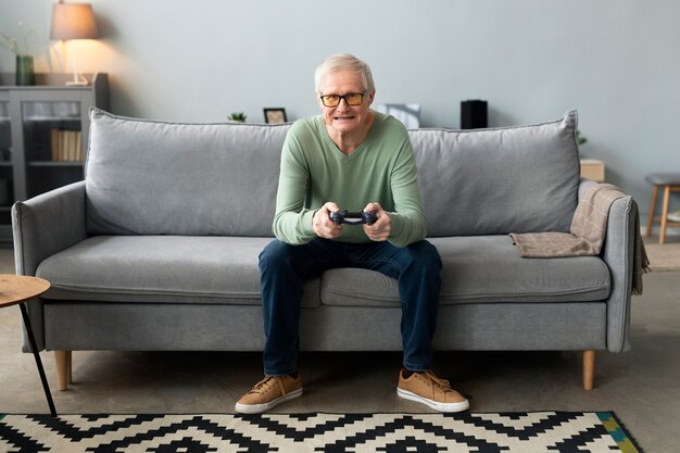 Senior man playing videogames