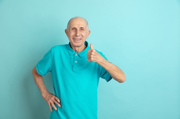 Senior man showing thumb up