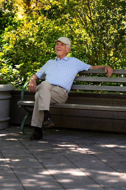 Free photo senior man taking a walk outdoors in the city