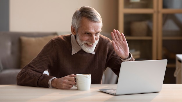 Senior man video conferencing