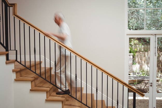 Senior man walking up stairs