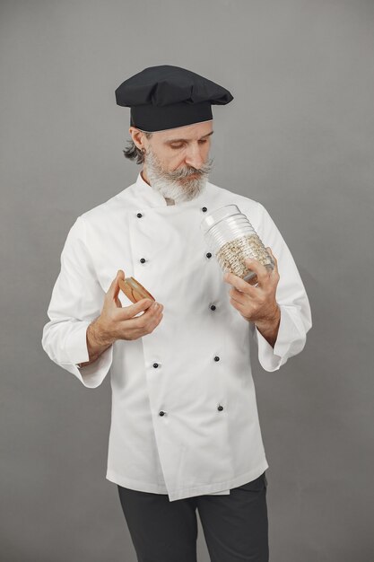 Senior man with jar of oatmeal.