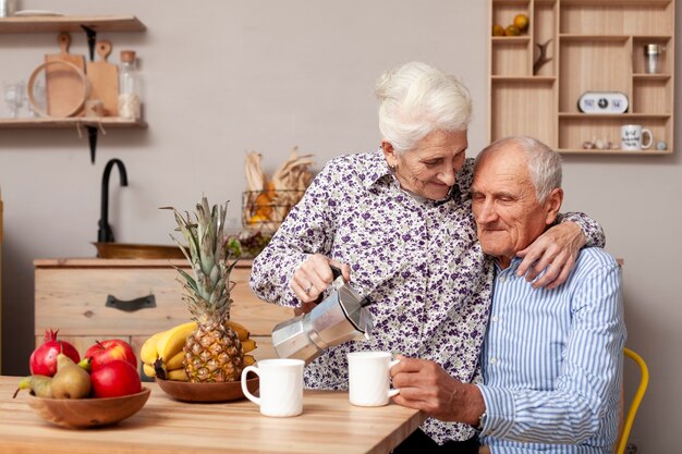 Senior man and woman having coffee