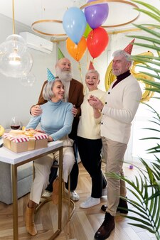 Senior people celebrating together