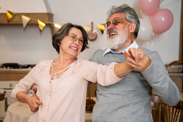 Senior people dancing at party