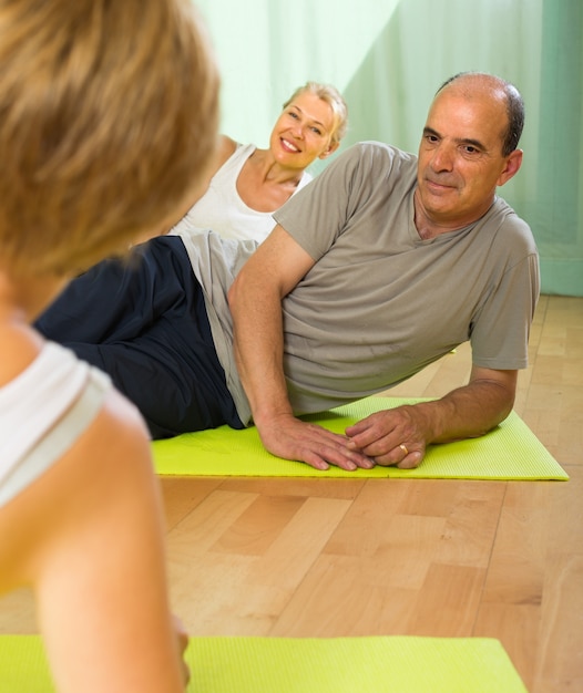 Senior people on fitness with instructor
