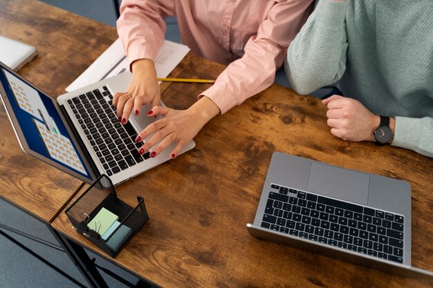 Senior people in school during class with laptop computer